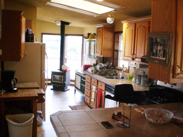 a view of a green field with wooden fence