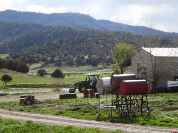 a view of yard with outdoor seating and green space