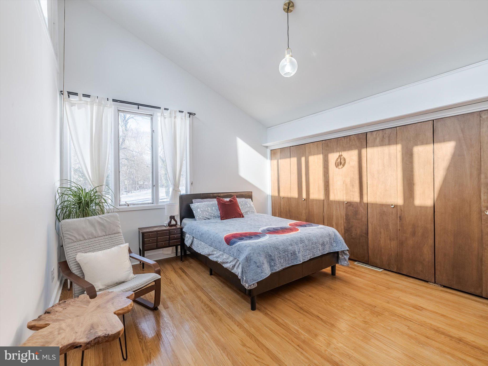 919 Laburnum Lane Wyncote, PA 19095 - Photo 11 of 43 a bedroom with a bed and wooden floor