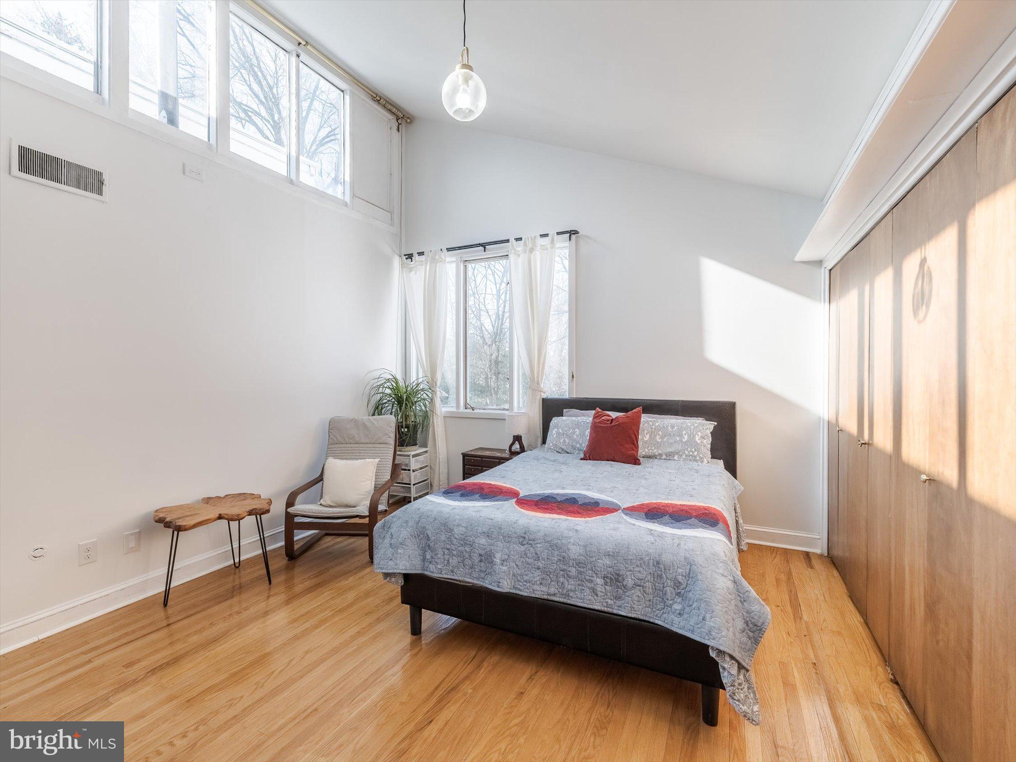 919 Laburnum Lane Wyncote, PA 19095 - Photo 12 of 43 a bedroom with a bed and a table in it