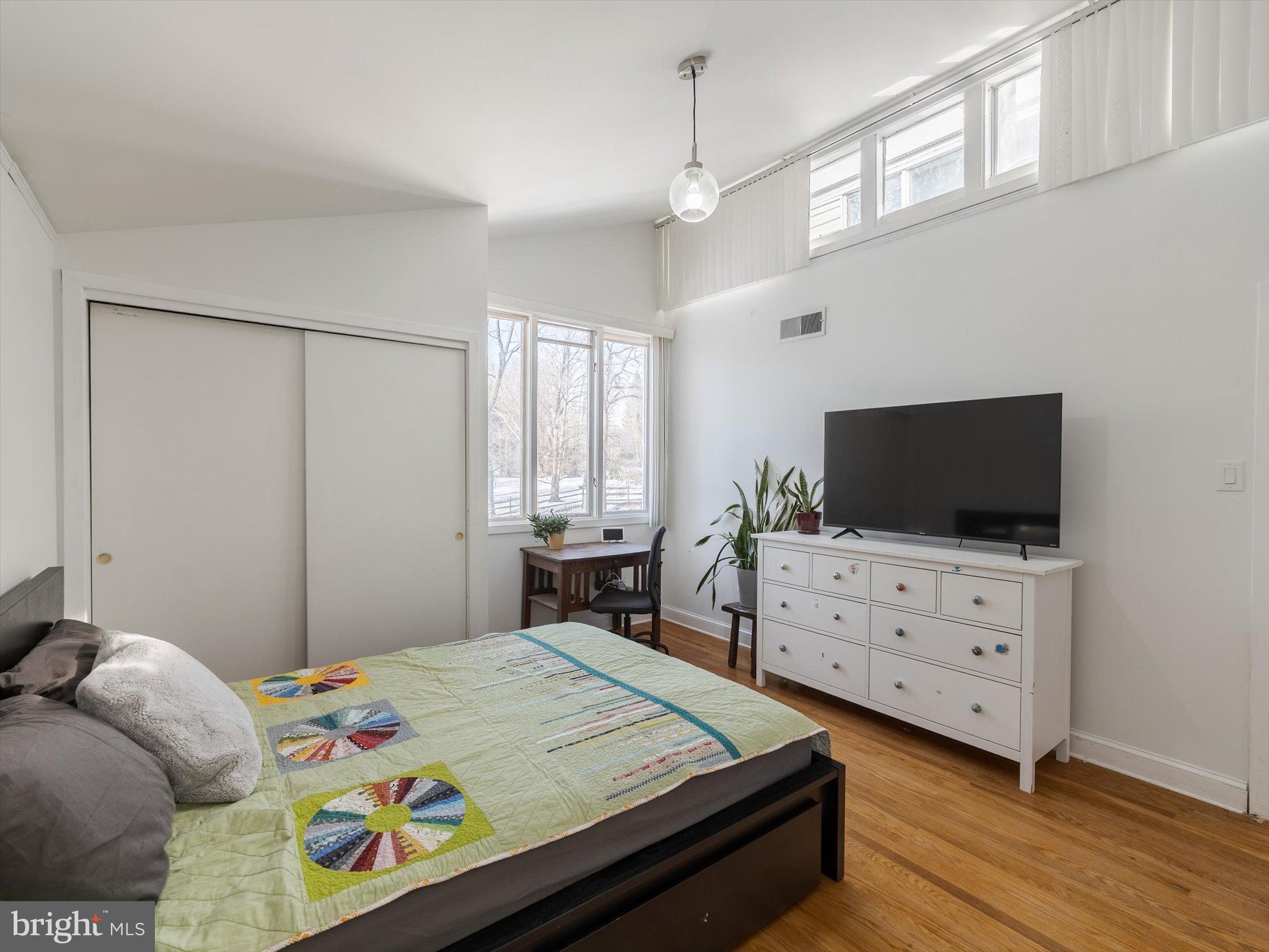 919 Laburnum Lane Wyncote, PA 19095 - Photo 19 of 43 a bedroom with a bed a flat screen tv and a window
