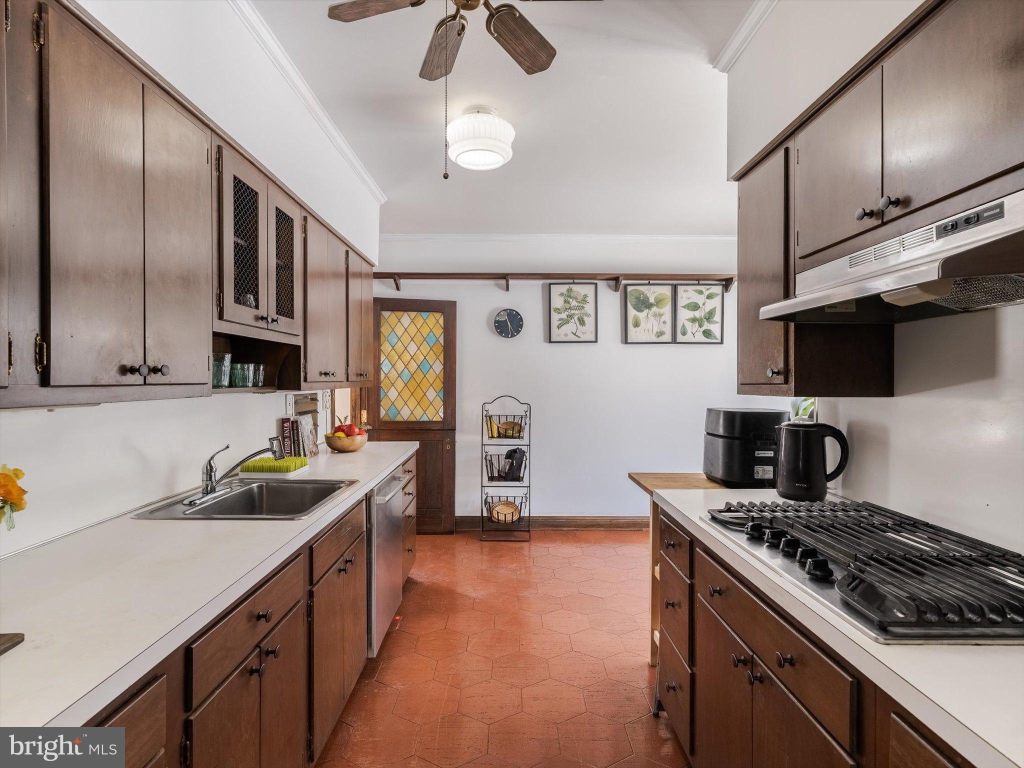 919 Laburnum Lane Wyncote, PA 19095 - Photo 25 of 43 a kitchen with stainless steel appliances granite countertop a sink stove and refrigerator