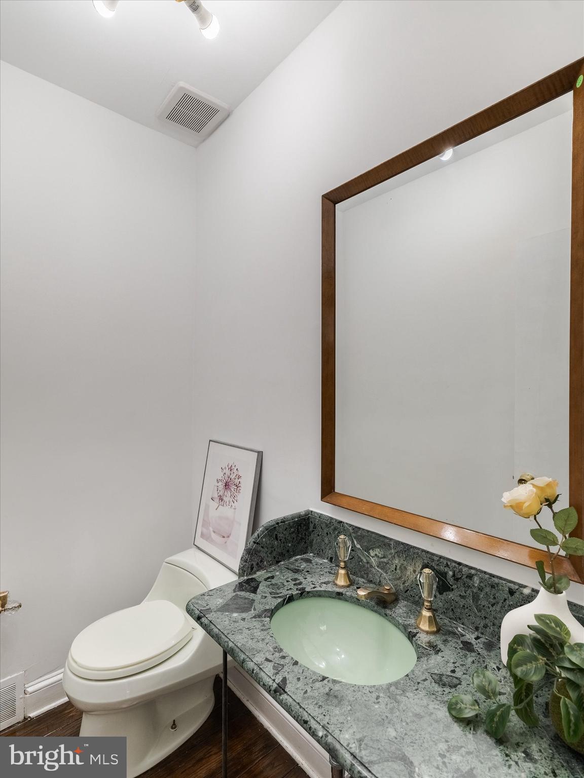 919 Laburnum Lane Wyncote, PA 19095 - Photo 27 of 43 a bathroom with a granite countertop sink and a mirror