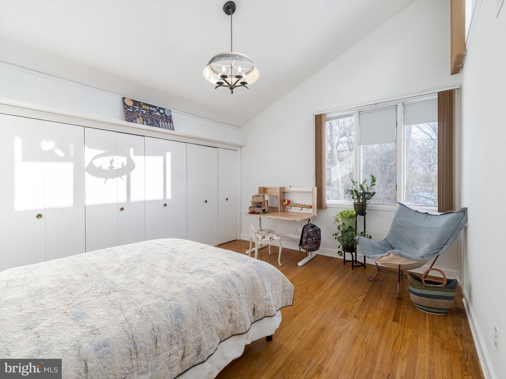 919 Laburnum Lane Wyncote, PA 19095 - Photo 8 of 43 a bedroom with a bed and wooden floor