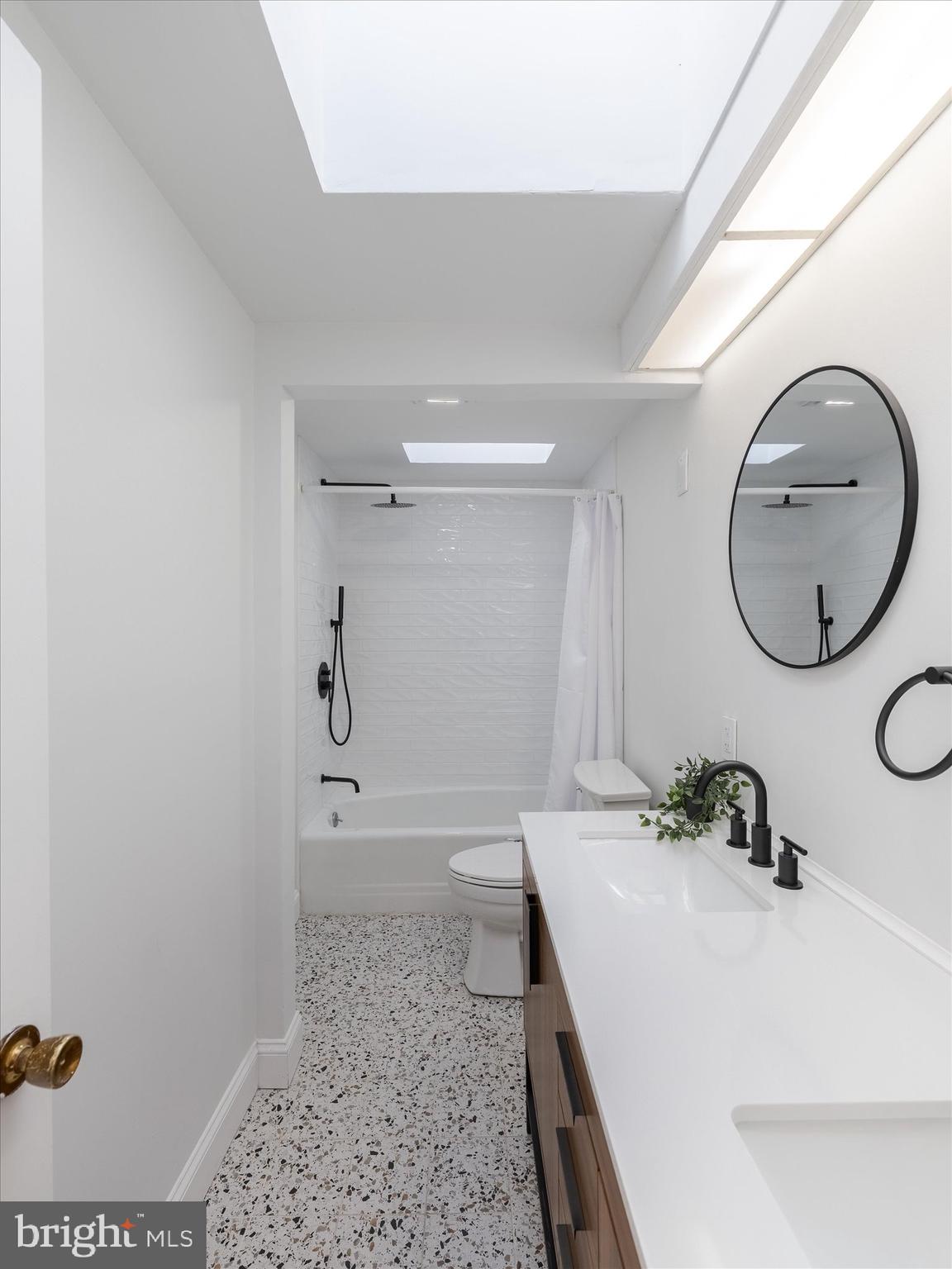 919 Laburnum Lane Wyncote, PA 19095 - Photo 9 of 43 a bathroom with a sink and a mirror