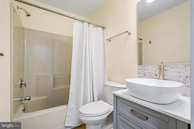 an empty room with a empty space and windows