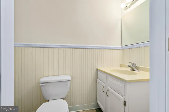 a view of a bathroom with a black and white checkered floor