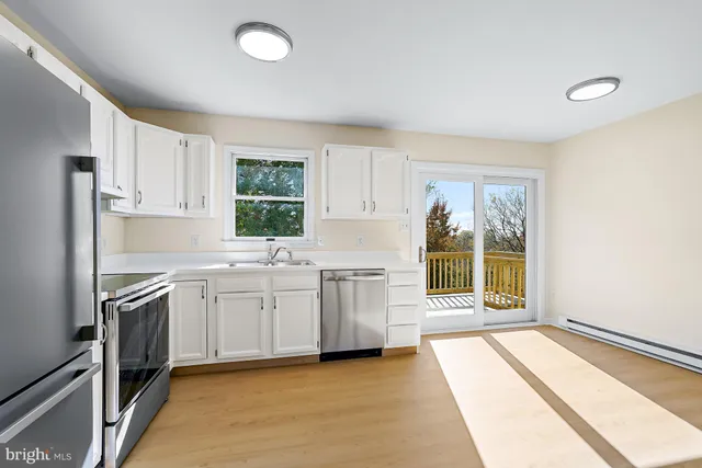 a kitchen with a sink stove and refrigerator