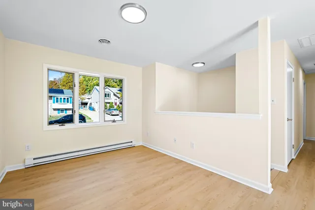 a view of an empty room and window