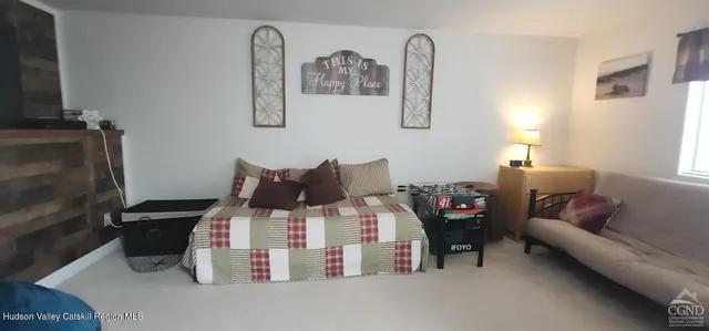 a bedroom with bed and a couch