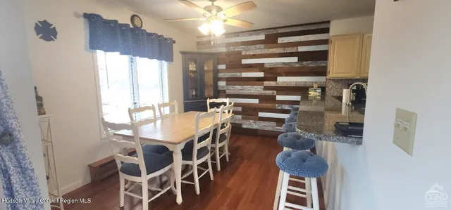 a dining room with furniture and window