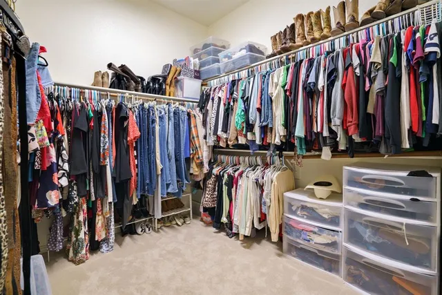 a bathroom with a tub a sink and mirror