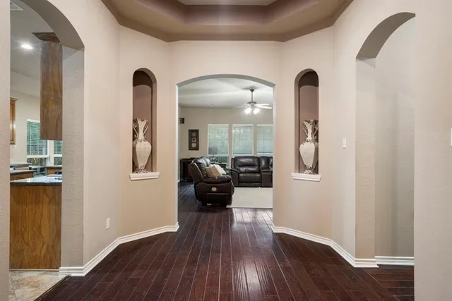 a view of a dining room with furniture and wooden floor