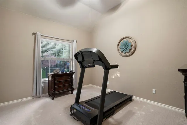 a bed room with a bed and a chandelier