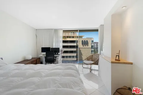 a bedroom with a bed and furniture