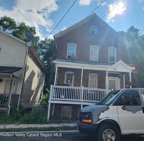 a front view of a house with yard