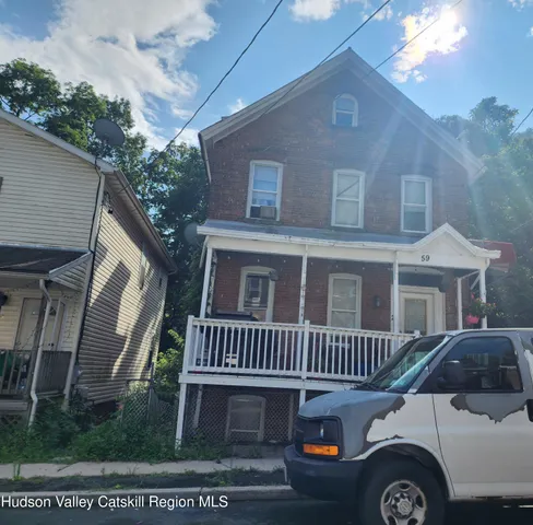 a front view of a house with yard