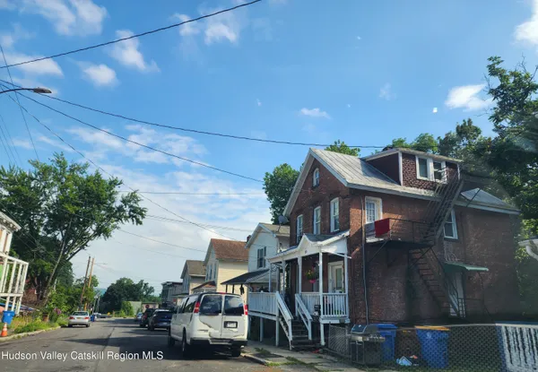 a view of multiple houses with a street