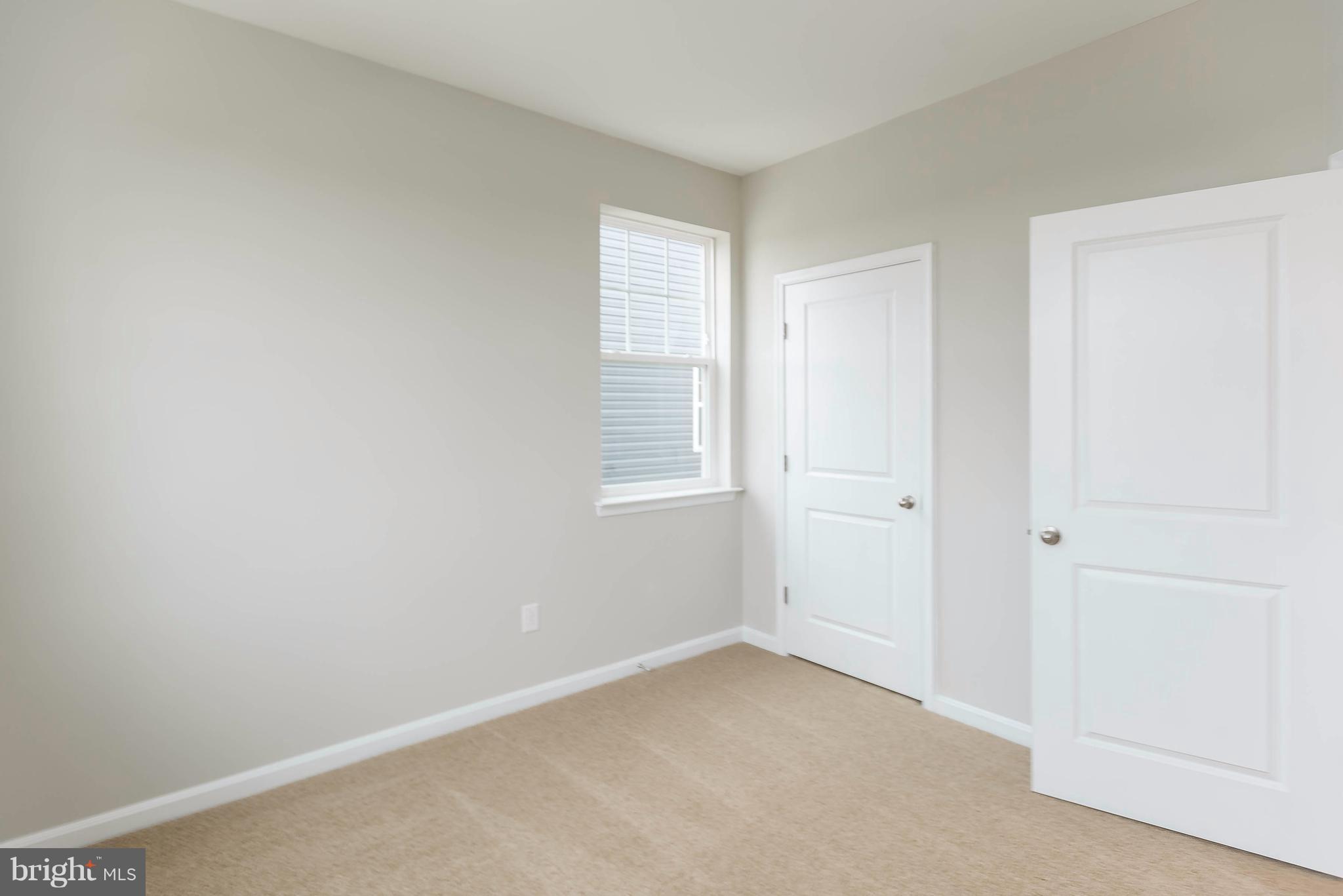 4609 Cambria Road Frederick, MD 21703 - Photo 23 of 29 a view of an empty room with a window