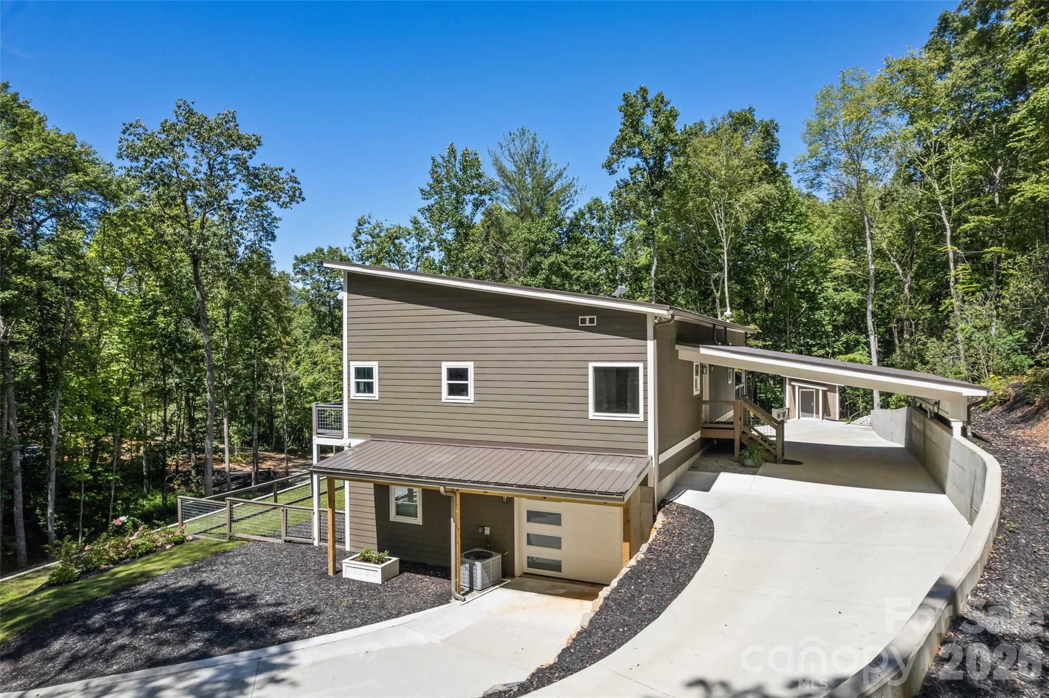 1185 Wallalieu Road Otto, NC 28763 - Photo 5 of 43 a view of a house with a backyard