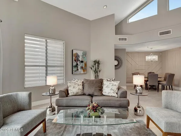 a living room with furniture and a large window