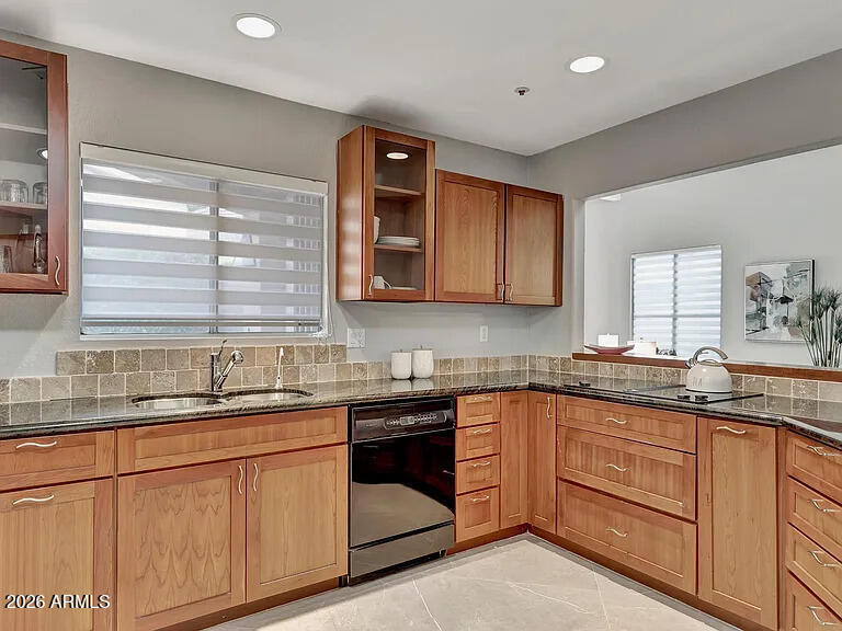 7773 East Stallion Road Scottsdale, AZ 85258 - Photo 13 of 33 a kitchen with granite countertop stainless steel appliances a sink stove and cabinets