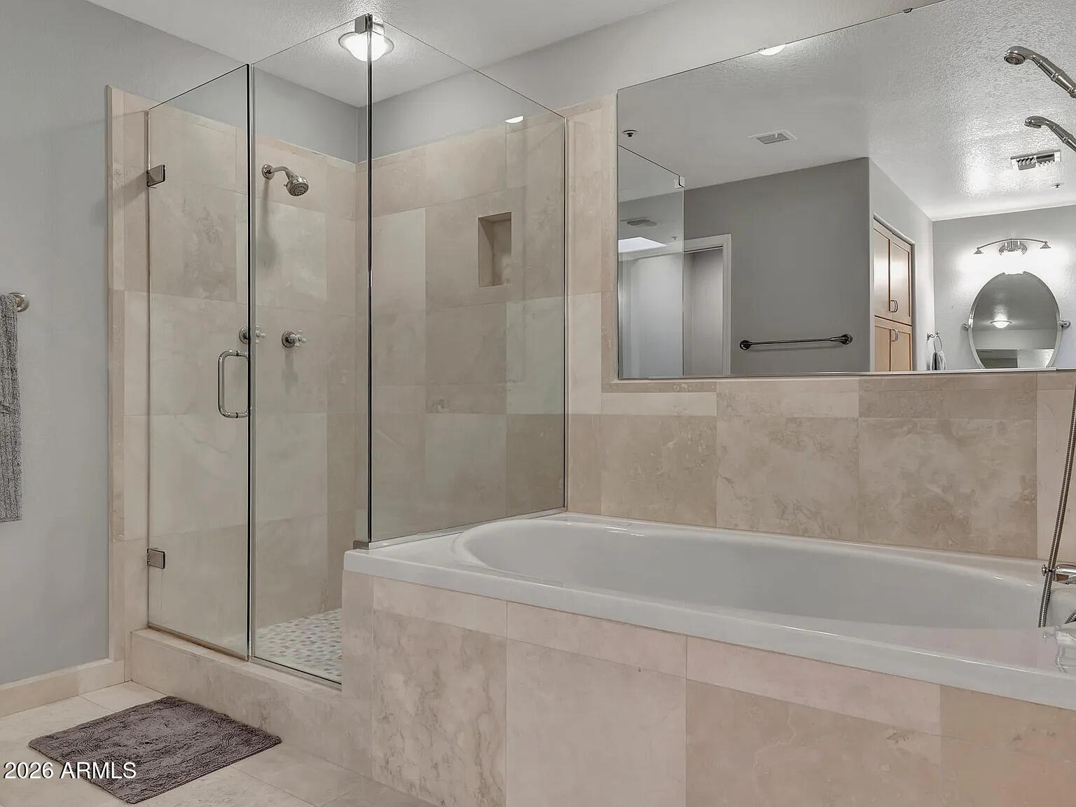 7773 East Stallion Road Scottsdale, AZ 85258 - Photo 16 of 33 a bathroom with a bathtub and a shower