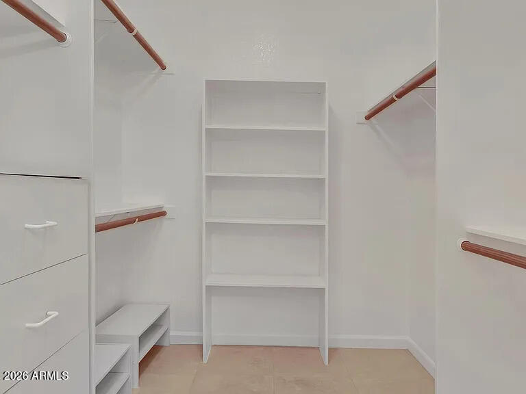 7773 East Stallion Road Scottsdale, AZ 85258 - Photo 17 of 33 a view of walk in closet with empty racks