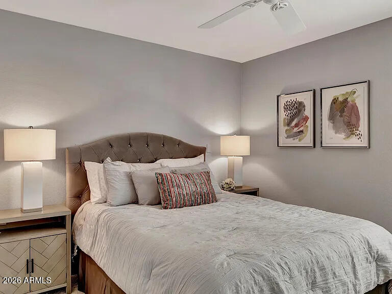 7773 East Stallion Road Scottsdale, AZ 85258 - Photo 19 of 33 a bedroom with a bed and a lamp