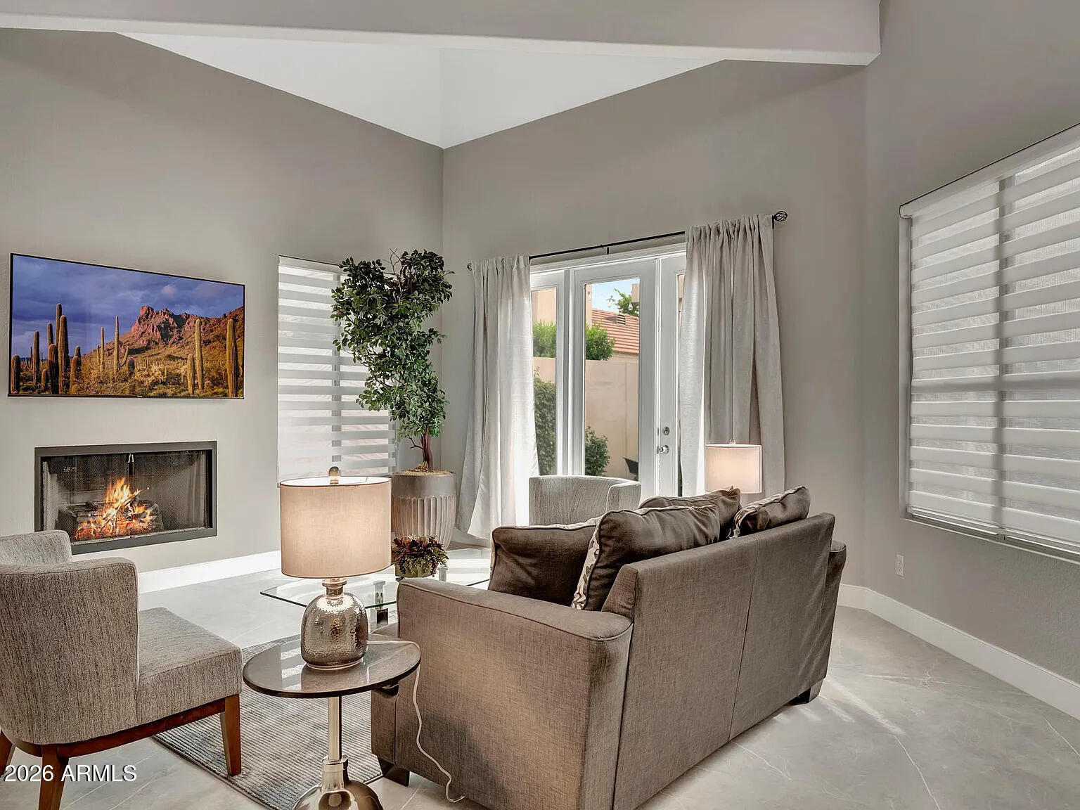 7773 East Stallion Road Scottsdale, AZ 85258 - Photo 5 of 33 a living room with furniture and a fireplace