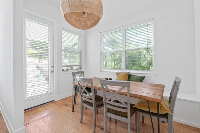 a view of a dining room with furniture and window
