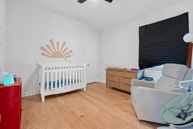 a bedroom with furniture and a window