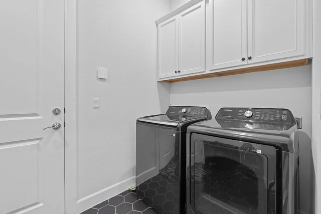 a view of storage and utility room with washer and dryer