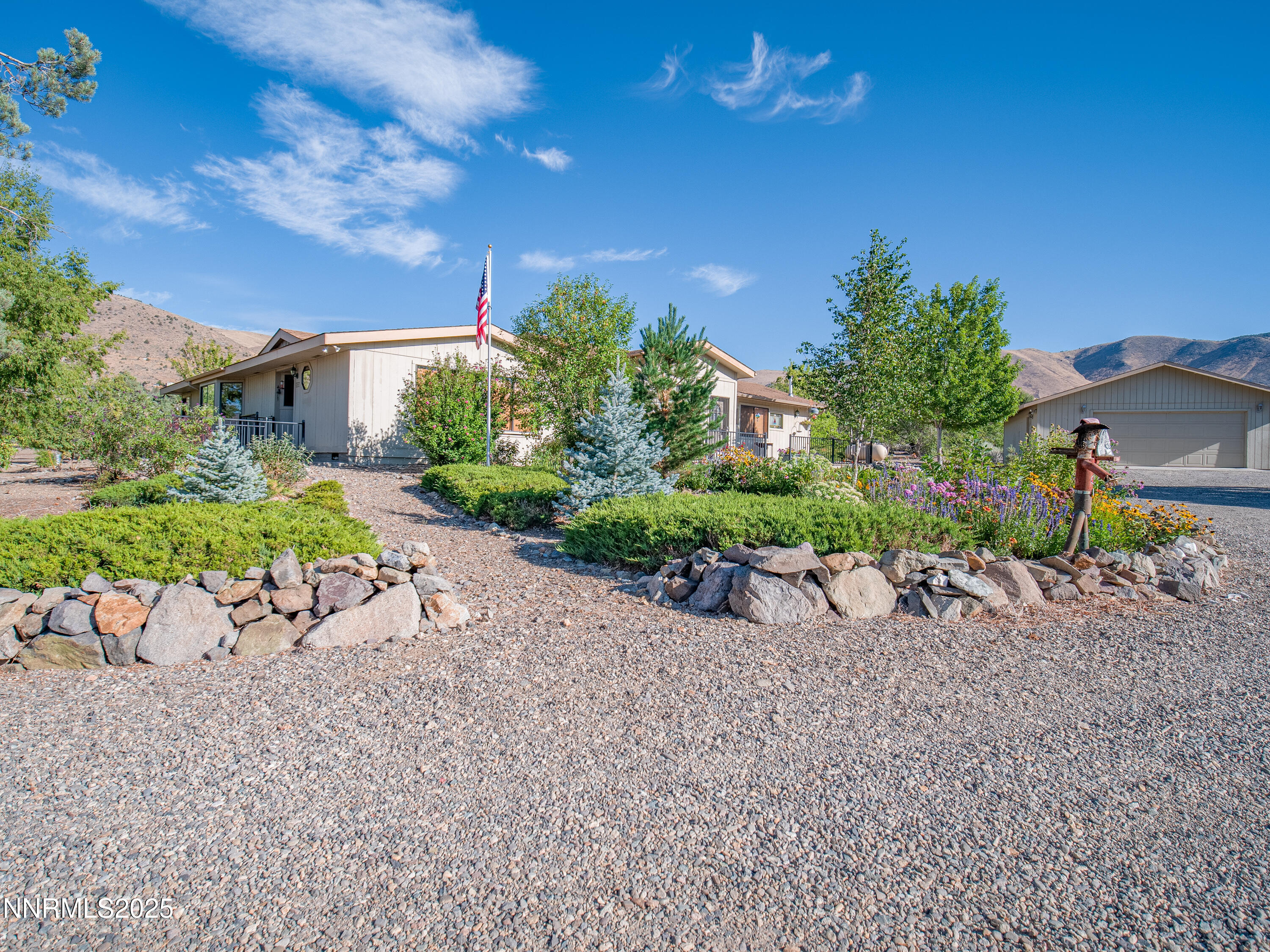 3670 Pine Nut Way Topaz Ranch Estates, NV 89444 - Photo 1 of 74 a view of a chair and table in the garden