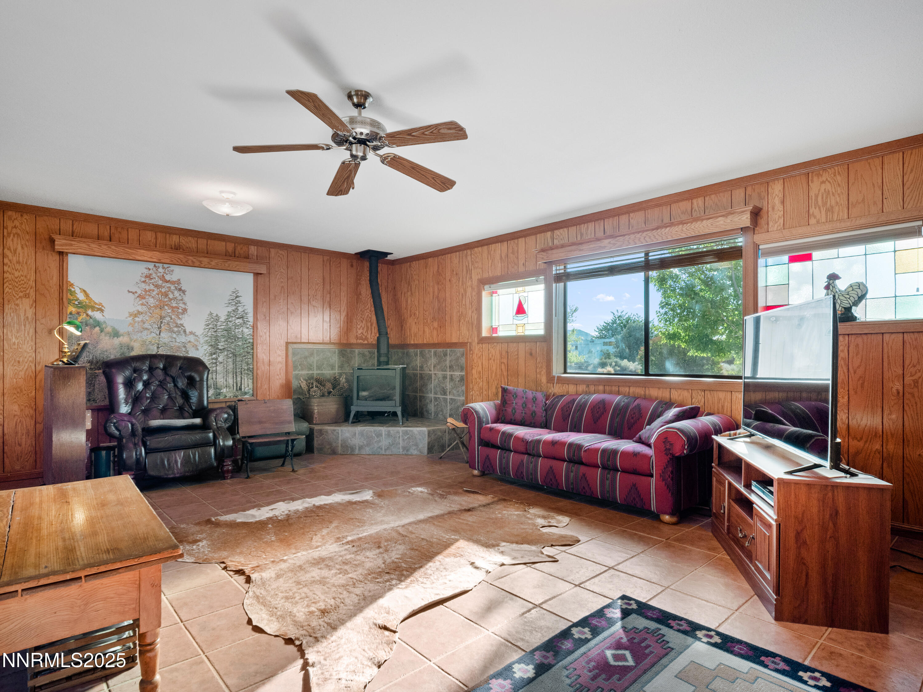 3670 Pine Nut Way Topaz Ranch Estates, NV 89444 - Photo 11 of 74 a living room with furniture a flat screen tv and a large window