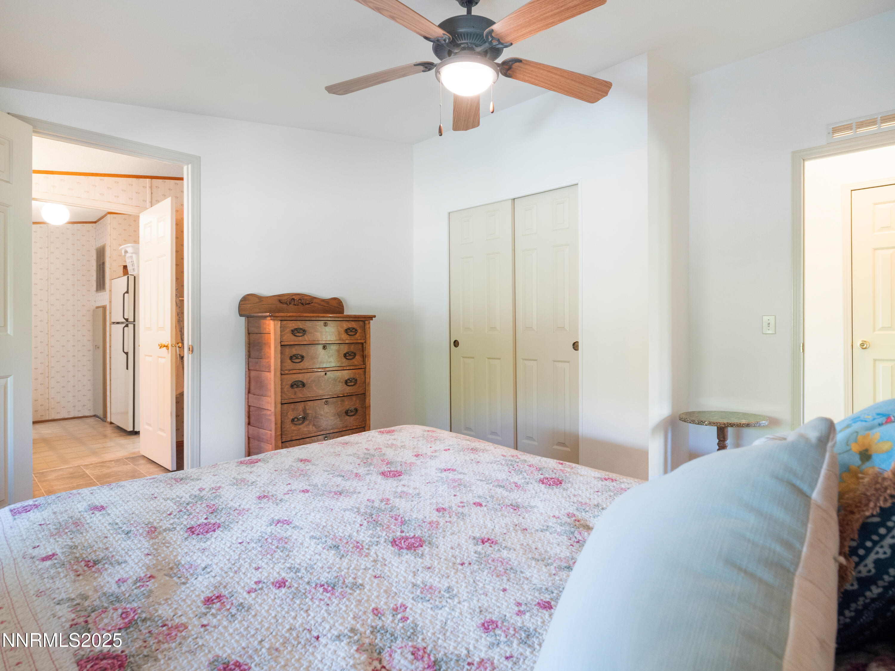 3670 Pine Nut Way Topaz Ranch Estates, NV 89444 - Photo 22 of 74 a bedroom with a bed and a chandelier