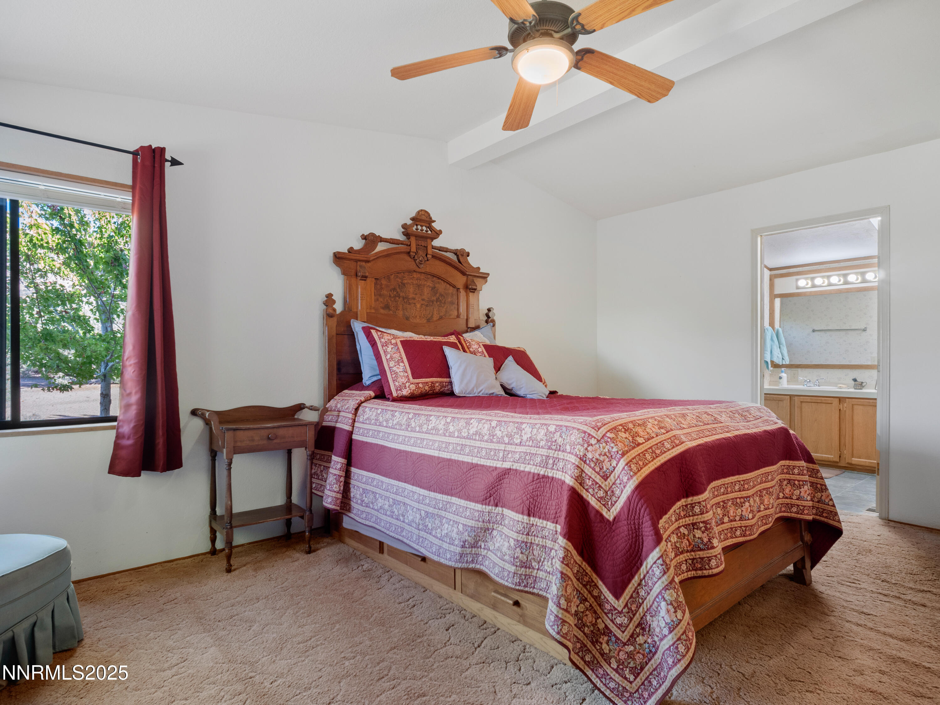 3670 Pine Nut Way Topaz Ranch Estates, NV 89444 - Photo 24 of 74 a bedroom with a bed and a chandelier