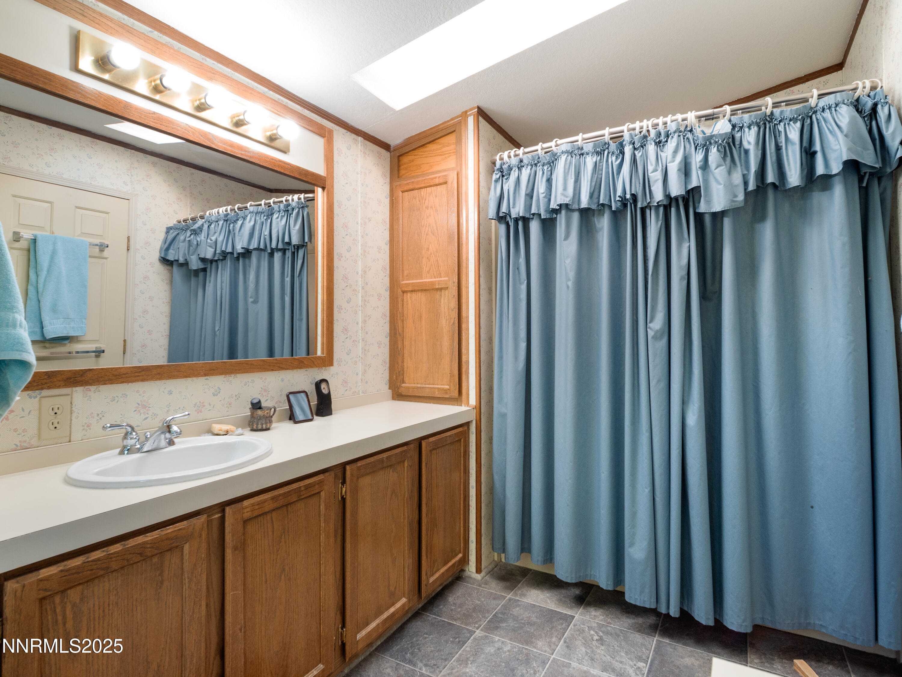 3670 Pine Nut Way Topaz Ranch Estates, NV 89444 - Photo 29 of 74 a bathroom with a sink and a mirror