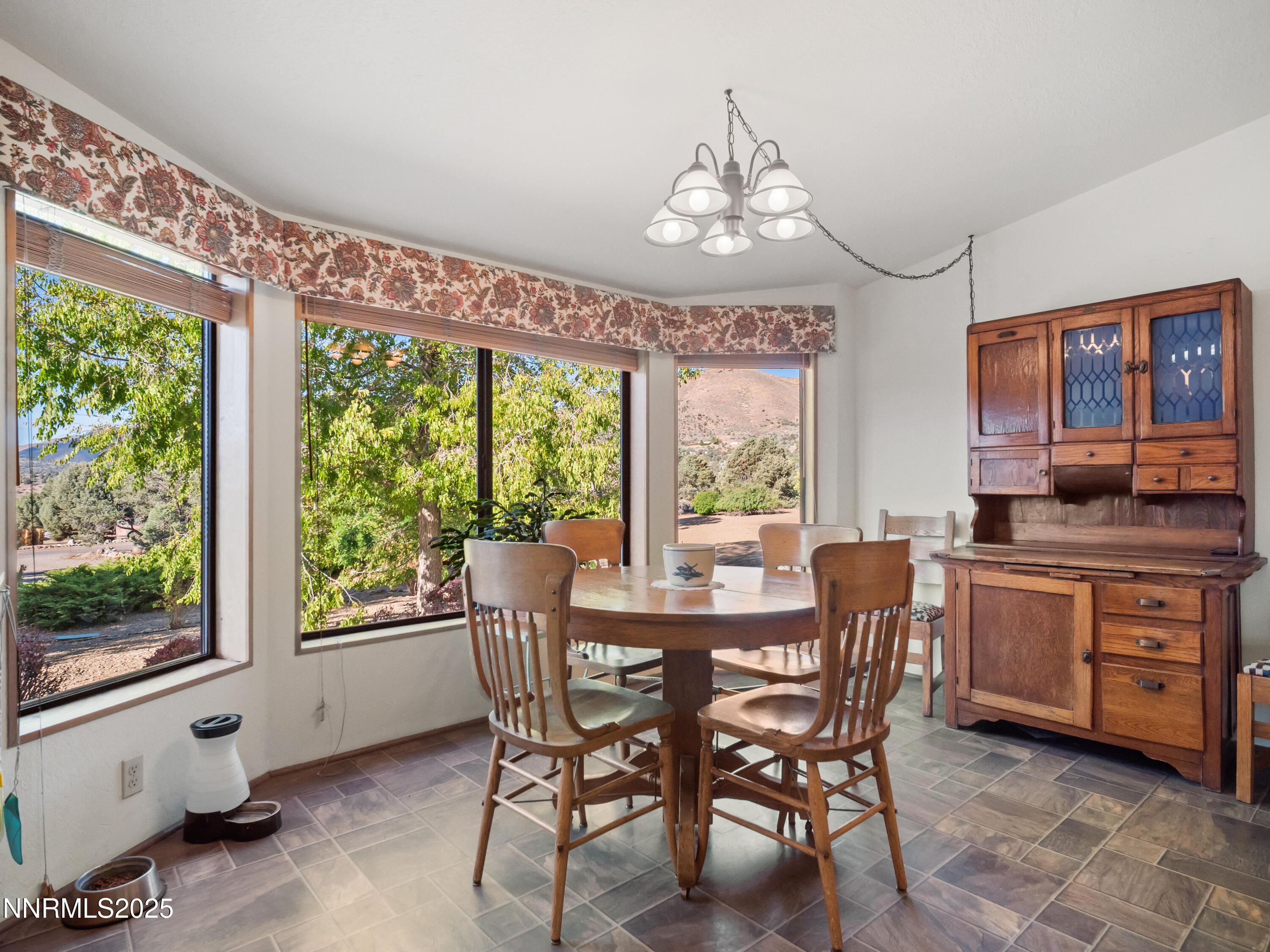 3670 Pine Nut Way Topaz Ranch Estates, NV 89444 - Photo 32 of 74 a view of a dining room with furniture window and outside view