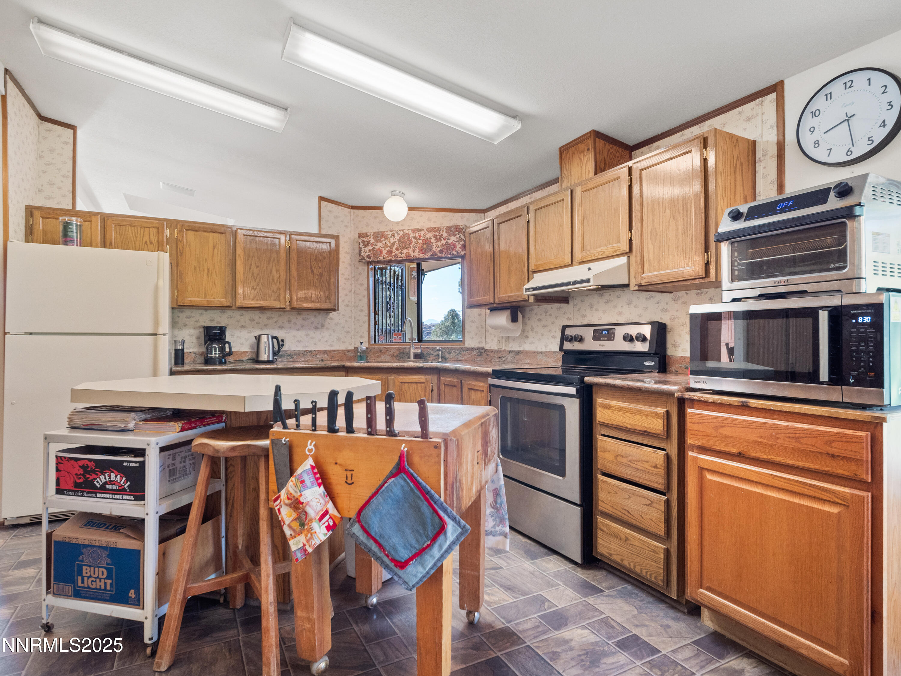 3670 Pine Nut Way Topaz Ranch Estates, NV 89444 - Photo 33 of 74 a kitchen with stainless steel appliances granite countertop a stove and cabinets
