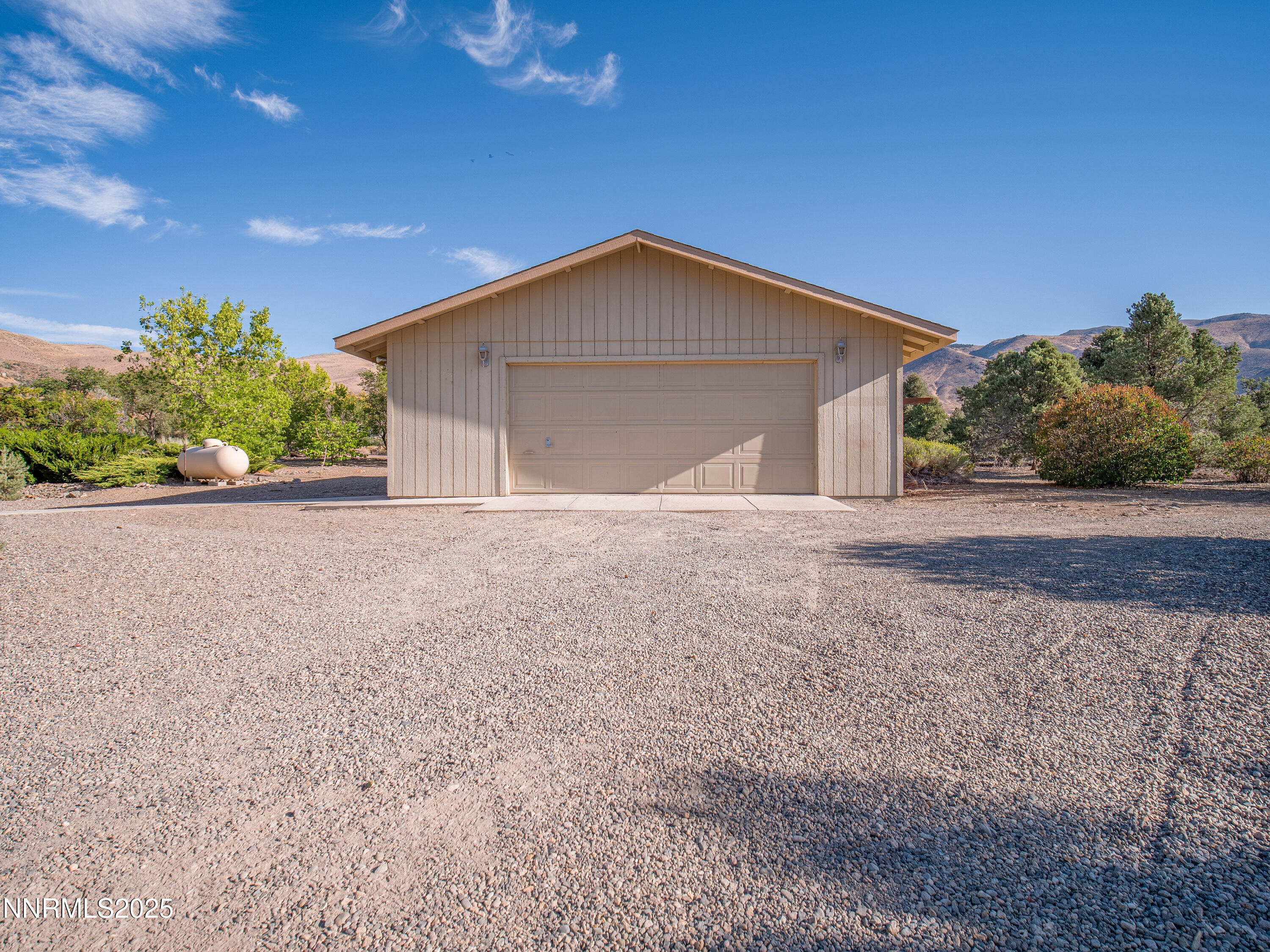 3670 Pine Nut Way Topaz Ranch Estates, NV 89444 - Photo 38 of 74 a view of a house with a yard and garage