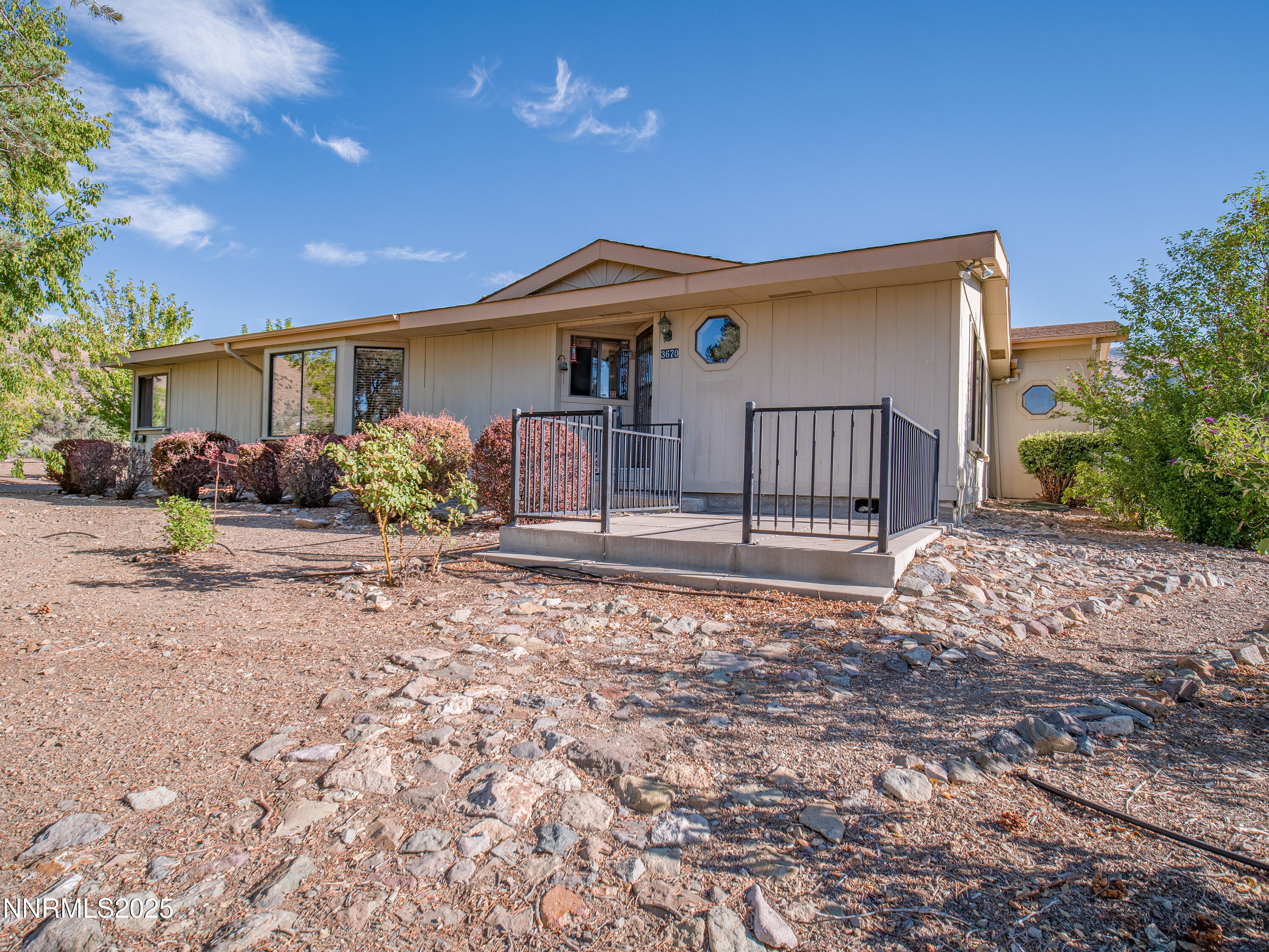 3670 Pine Nut Way Topaz Ranch Estates, NV 89444 - Photo 46 of 74 a front view of a house with a yard