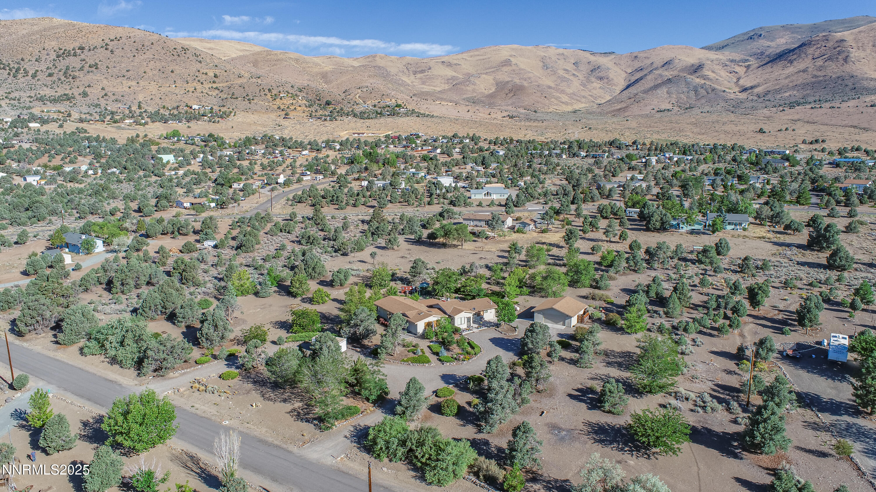 3670 Pine Nut Way Topaz Ranch Estates, NV 89444 - Photo 60 of 74 an aerial view of mountain with trees in the background