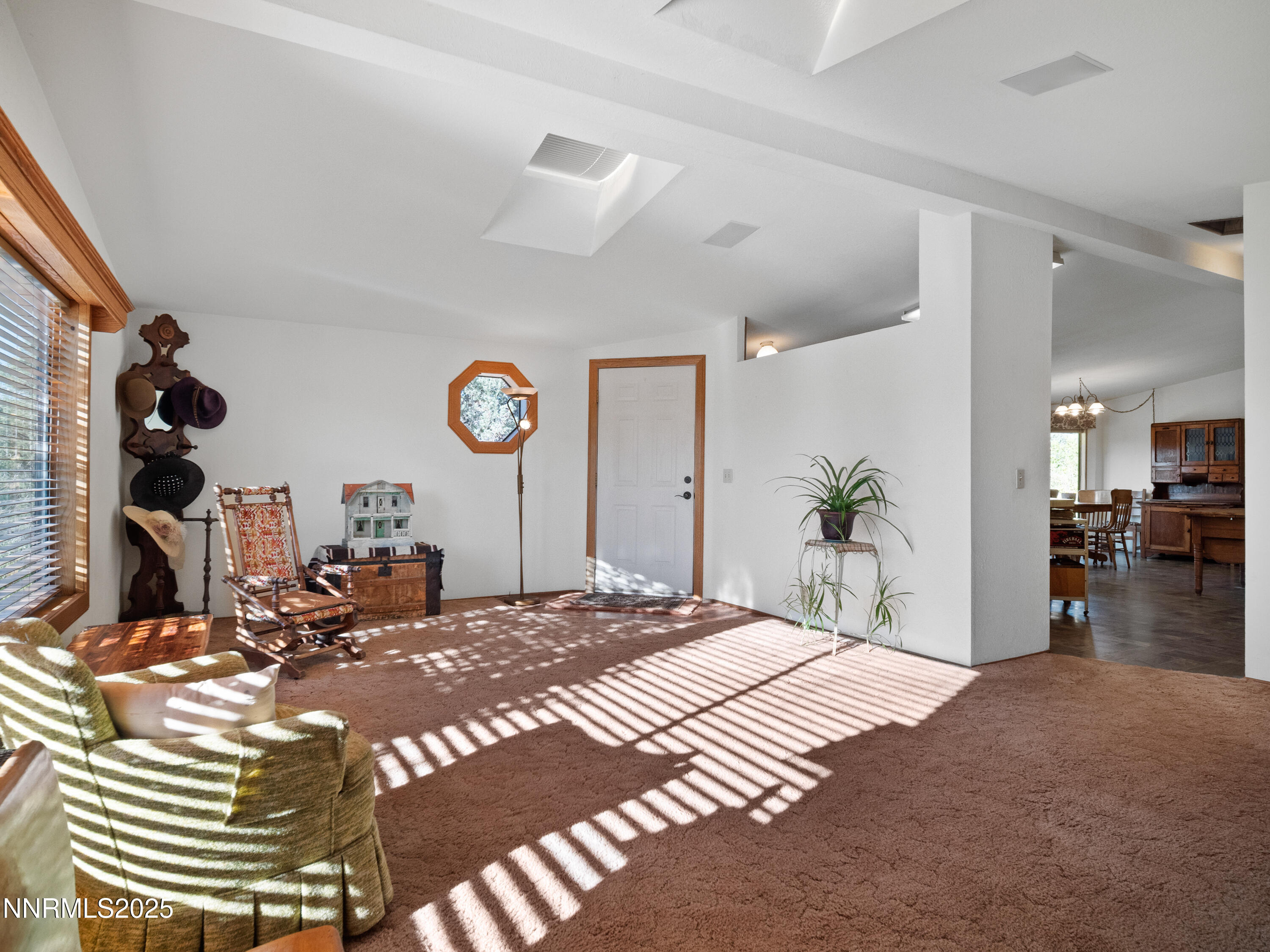 3670 Pine Nut Way Topaz Ranch Estates, NV 89444 - Photo 7 of 74 a bedroom with a bed and a chandelier