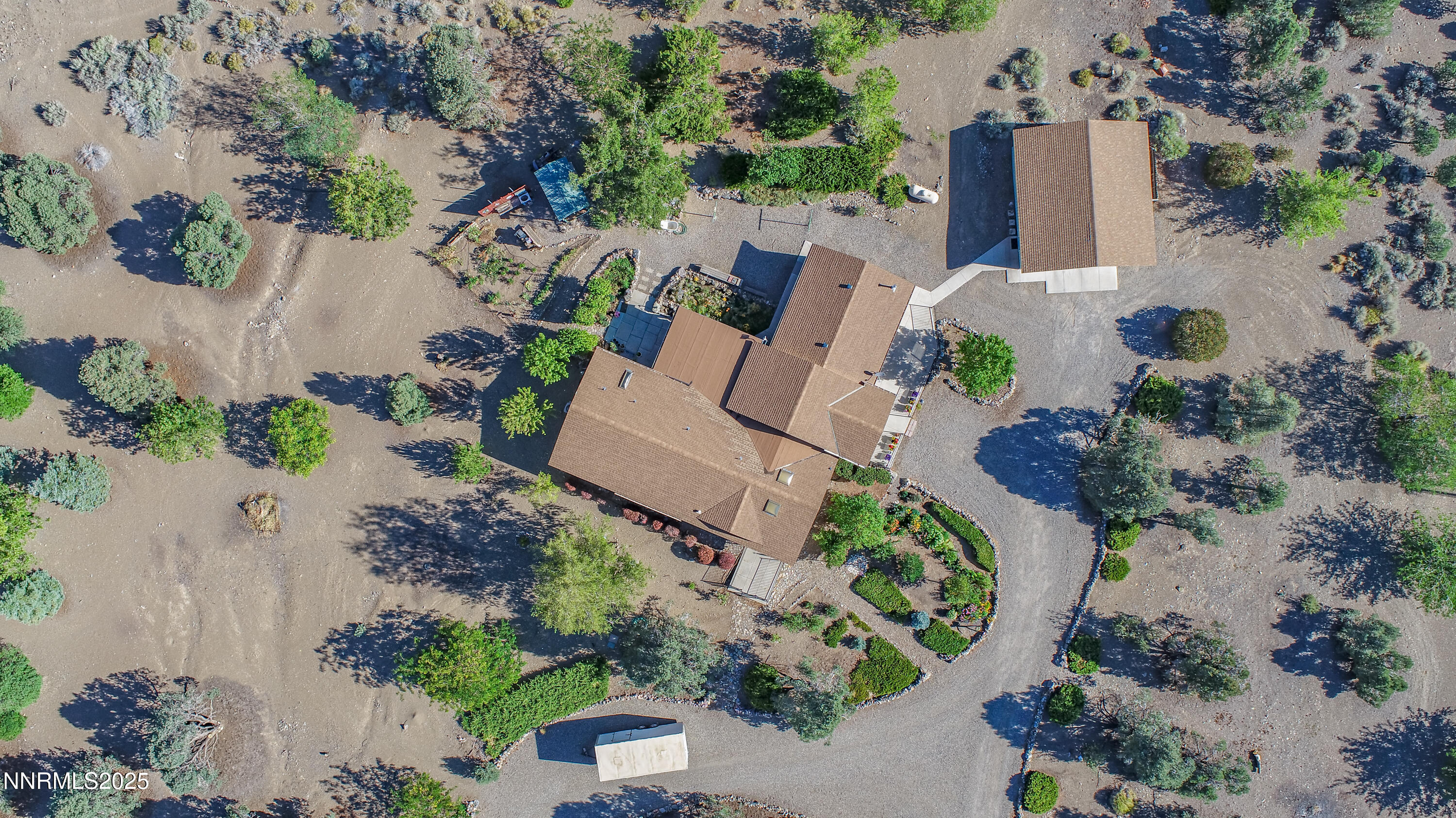 3670 Pine Nut Way Topaz Ranch Estates, NV 89444 - Photo 72 of 74 an aerial view of a house with a yard and a large tree