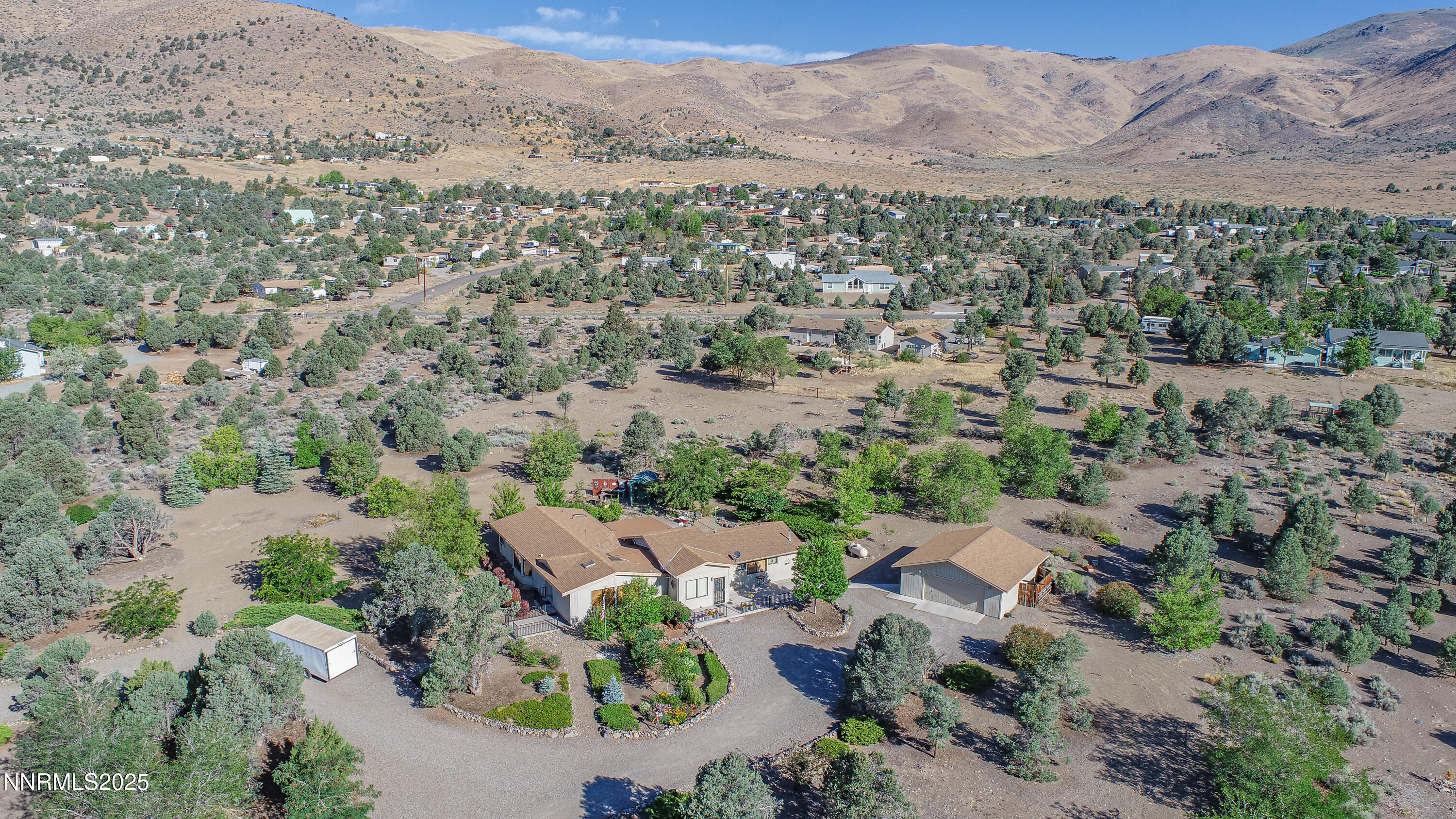 3670 Pine Nut Way Topaz Ranch Estates, NV 89444 - Photo 73 of 74 an aerial view of a house with a mountain