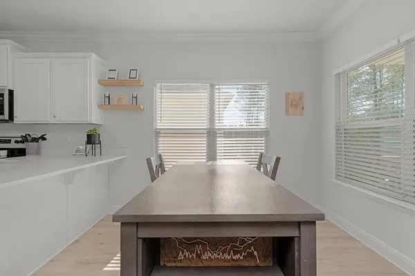 a kitchen with granite countertop a refrigerator stove and sink