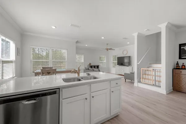 a utility room with sink dryer and washer