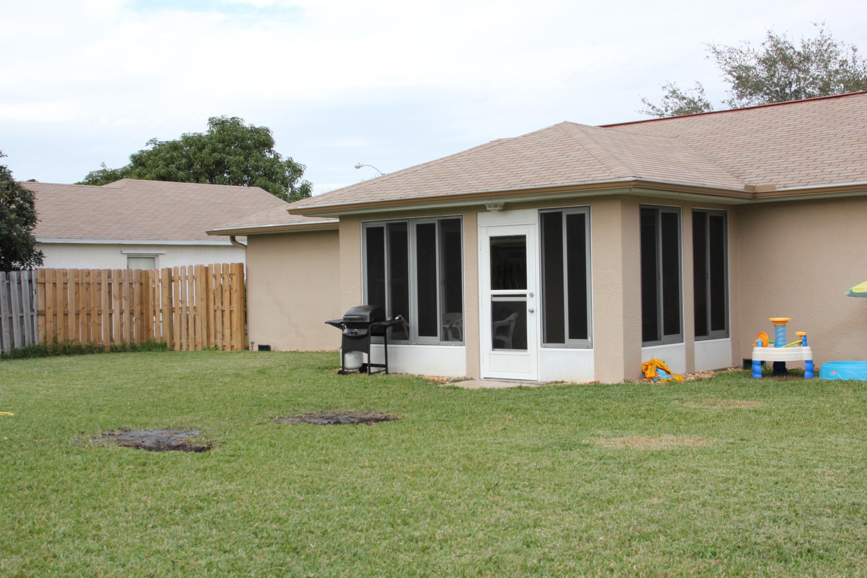 267 Twin Lakes Road Melbourne, FL 32901 - Photo 24 of 33 a view of a house with yard