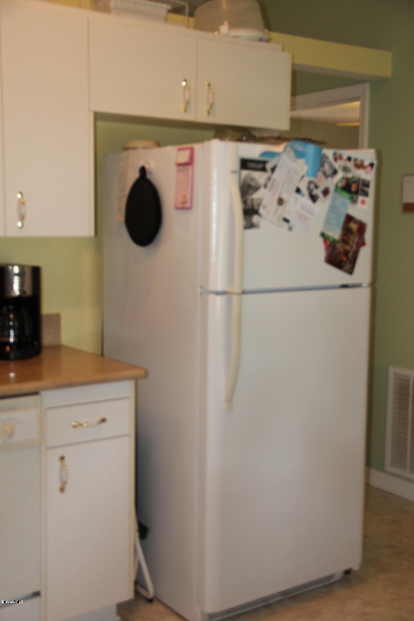 267 Twin Lakes Road Melbourne, FL 32901 - Photo 9 of 33 a utility room with dryer and washer